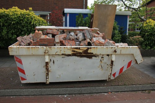 Furniture removal team collecting a sofa in Queenspark