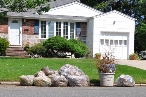 Rubbish removal service clearing household waste in Queenspark