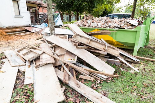 Workers collecting old white goods for recycling in Queenspark