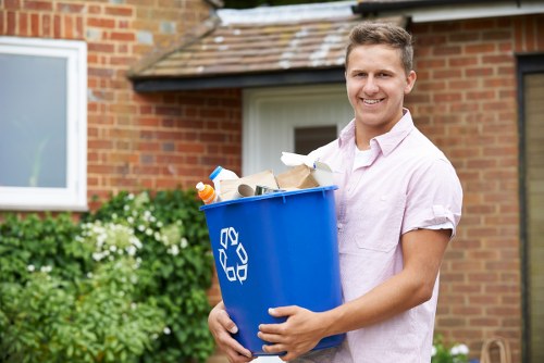 Worker identifying and sorting waste safely during removal