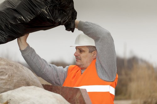 Professional loft clearance service sorting household items in Queenspark